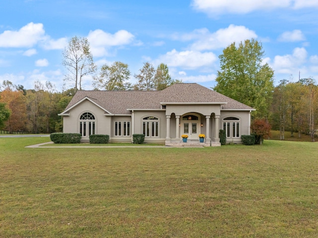 view of front of house with french doors and a front yard