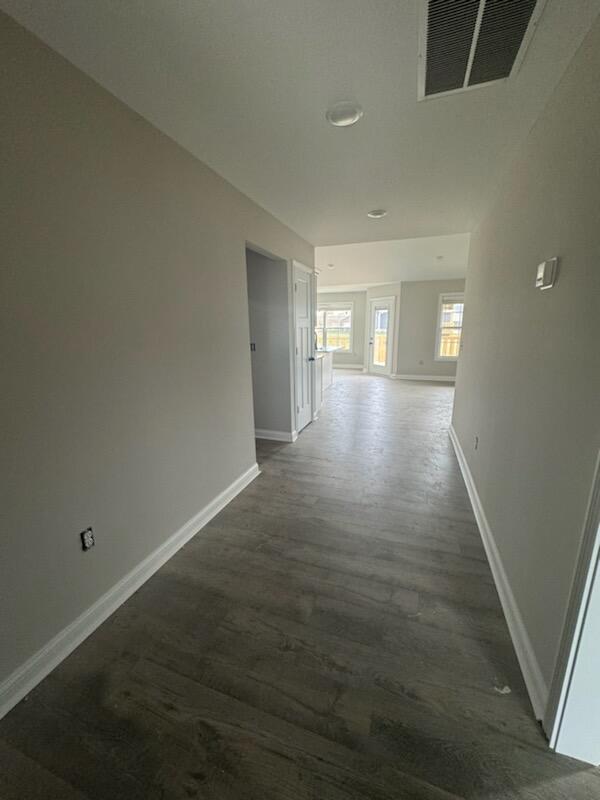 hallway featuring dark hardwood / wood-style floors