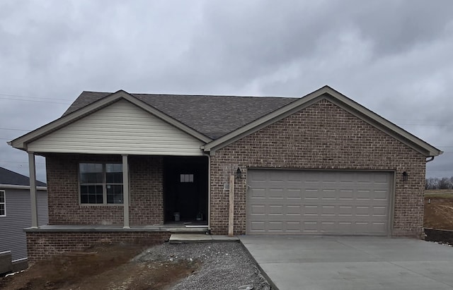 view of front of home with covered porch and a garage