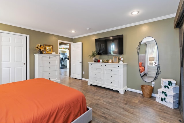 bedroom featuring ornamental molding and wood-type flooring