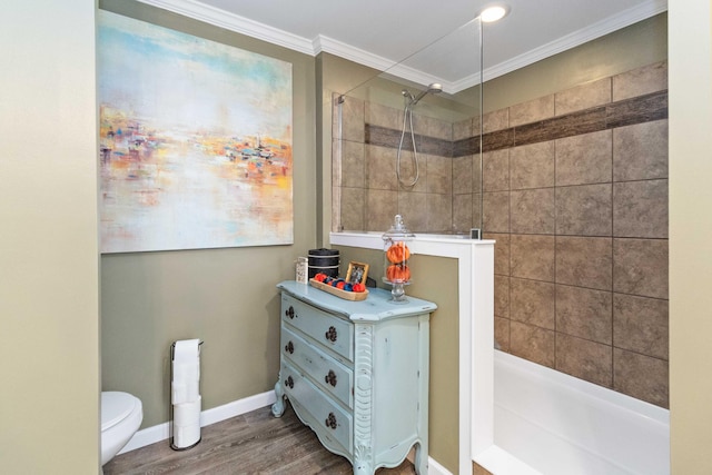 bathroom with ornamental molding, toilet, and hardwood / wood-style flooring