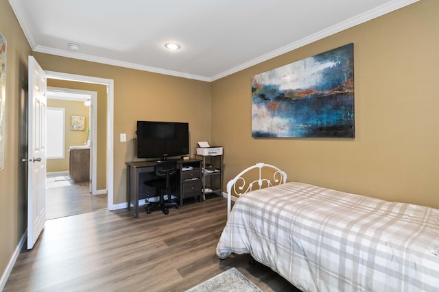 bedroom with crown molding and hardwood / wood-style flooring