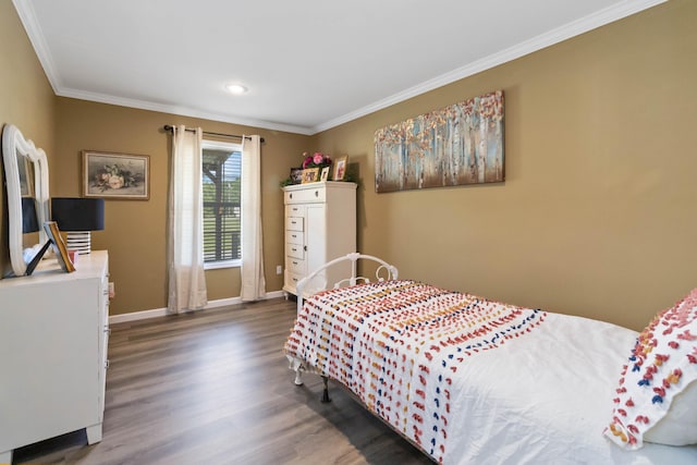 bedroom featuring dark hardwood / wood-style floors and crown molding