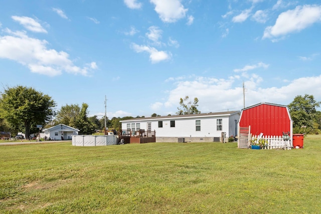 view of yard with a storage shed and central air condition unit