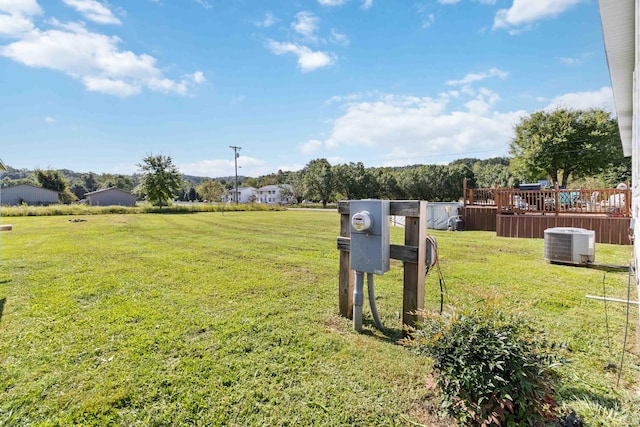 view of yard featuring central air condition unit