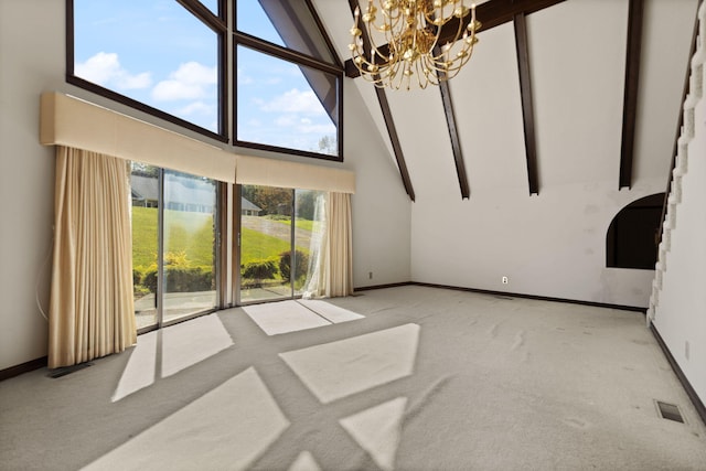 unfurnished living room featuring an inviting chandelier, light colored carpet, high vaulted ceiling, and beamed ceiling