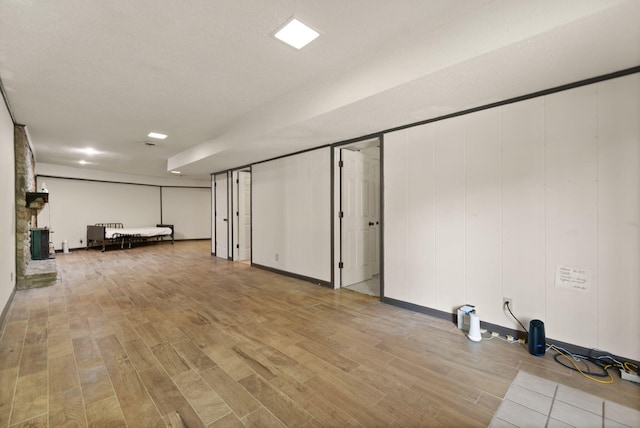 basement featuring light hardwood / wood-style floors