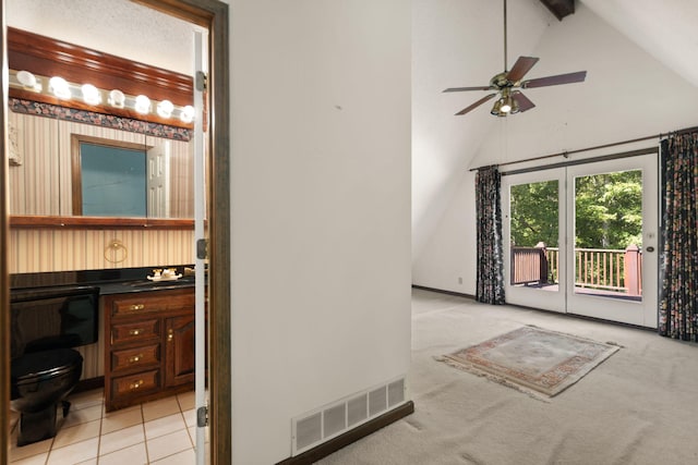 bathroom with high vaulted ceiling, vanity, ceiling fan, tile patterned floors, and beam ceiling