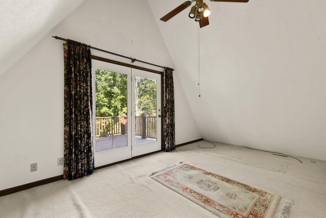 interior space with ceiling fan, carpet flooring, and high vaulted ceiling