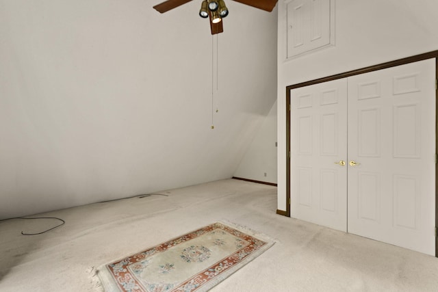 unfurnished bedroom with light carpet, a closet, and ceiling fan