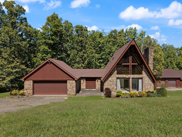 view of front of property with a garage and a front yard