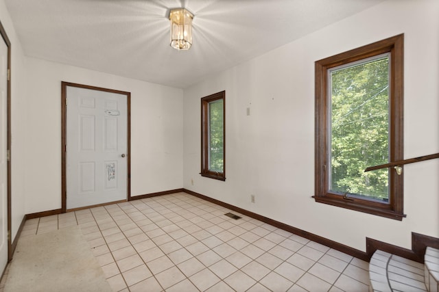 unfurnished bedroom featuring light tile patterned floors