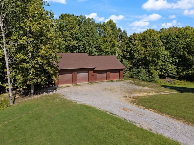 view of front facade with a garage and a front lawn