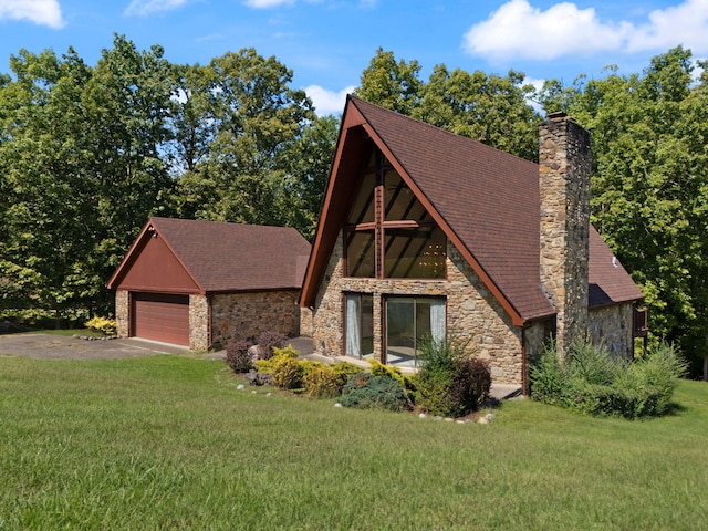 english style home with a garage and a front yard