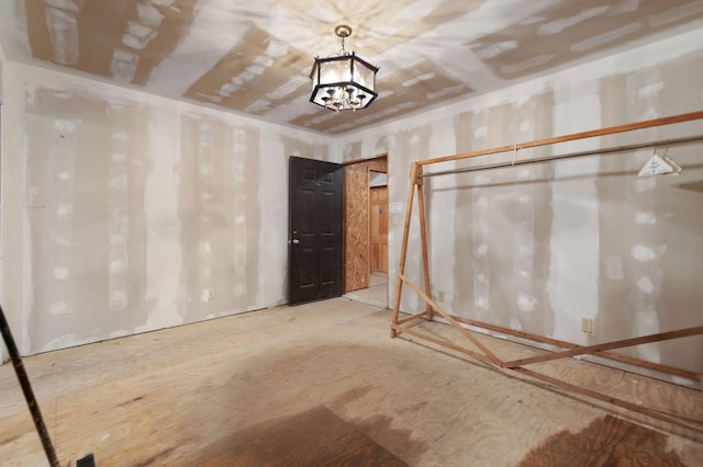 basement with a notable chandelier