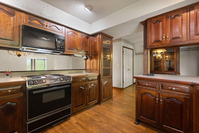 kitchen featuring range with electric cooktop and hardwood / wood-style floors