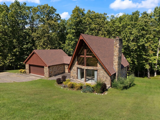 view of front facade with a garage and a front lawn