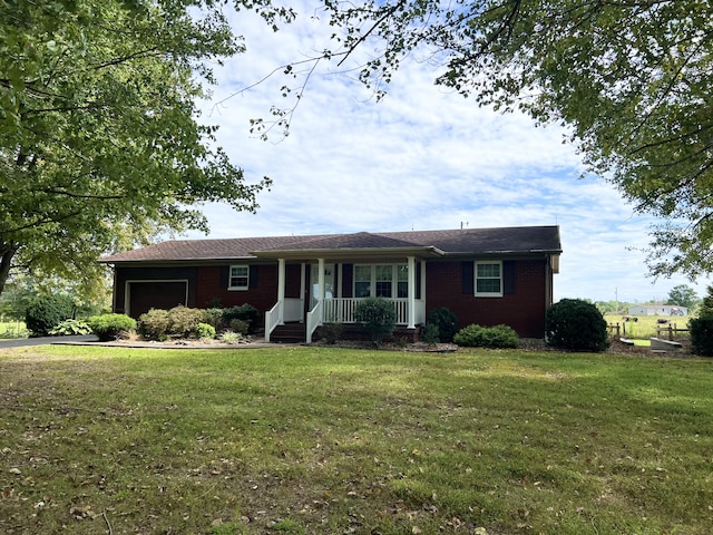 ranch-style home with a porch, a garage, and a front yard