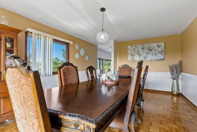 dining area with parquet floors