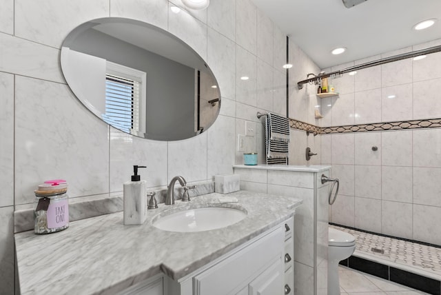 bathroom featuring tile walls, toilet, and tiled shower