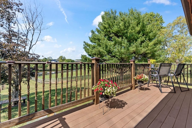 wooden deck with a yard