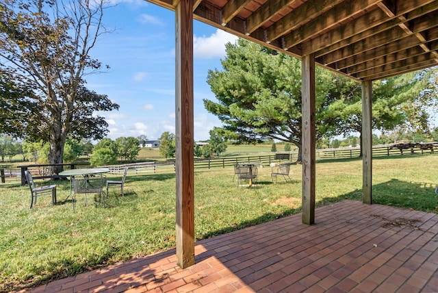 wooden deck featuring a patio and a yard