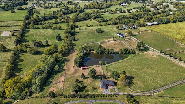 birds eye view of property featuring a water view and a rural view