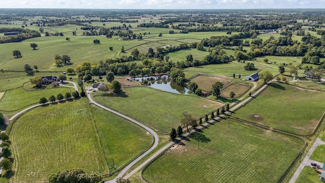 birds eye view of property with a water view and a rural view