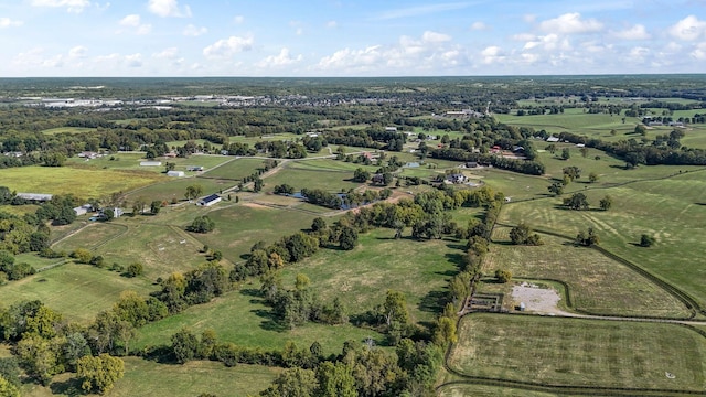 birds eye view of property with a rural view