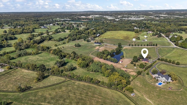 drone / aerial view with a rural view and a water view