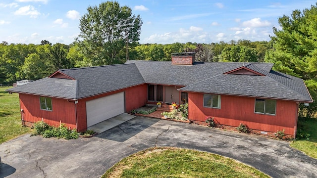 single story home with a garage