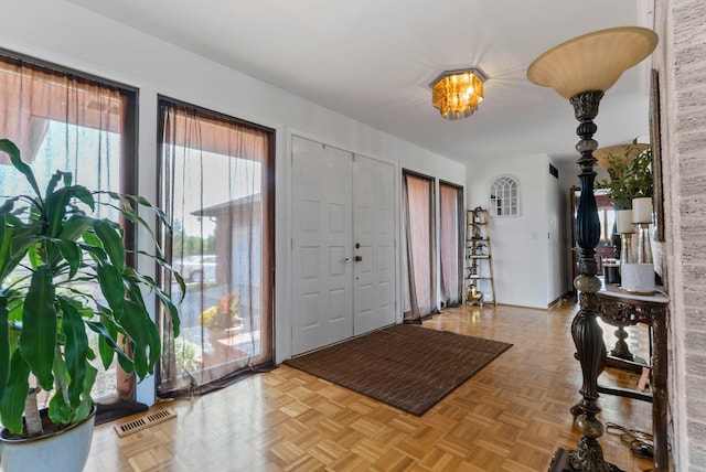 foyer featuring light parquet flooring