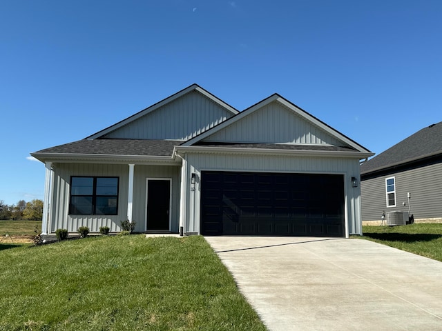 view of front of house with a garage and a front yard