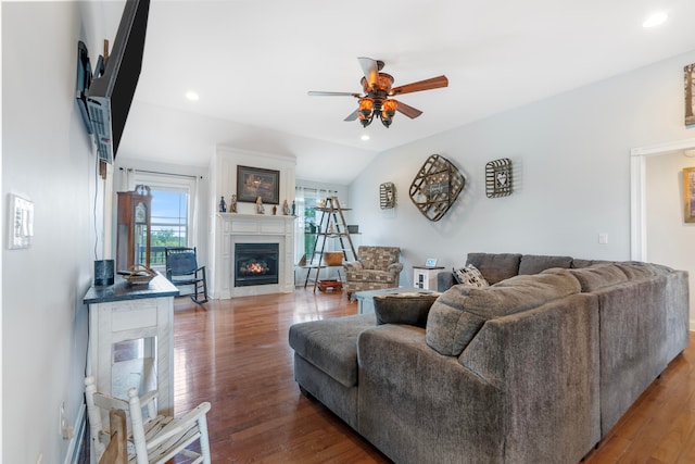 living room with vaulted ceiling, hardwood / wood-style floors, and ceiling fan