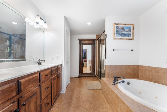 bathroom with plus walk in shower, tile patterned flooring, and vanity