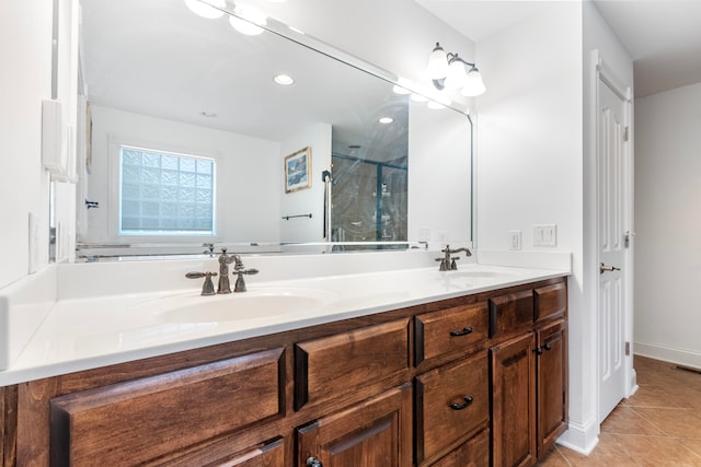 bathroom with tile patterned floors, a shower with door, and vanity