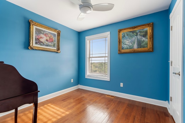 interior space featuring hardwood / wood-style floors and ceiling fan