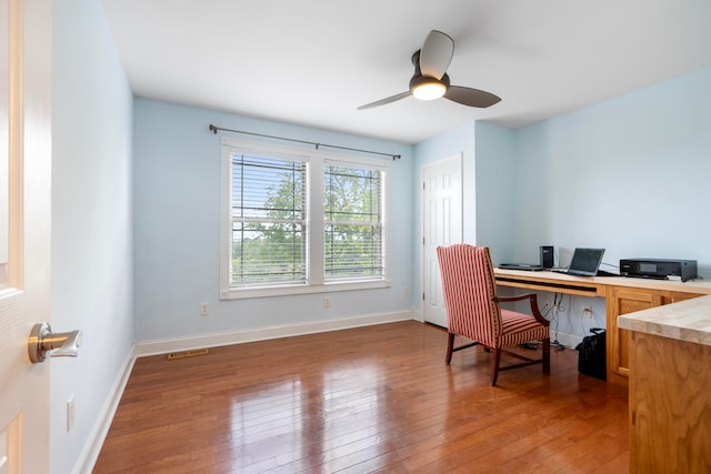 office featuring wood-type flooring and ceiling fan