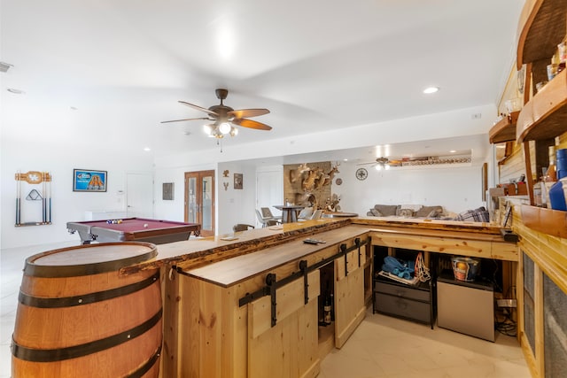 kitchen featuring pool table, kitchen peninsula, and ceiling fan