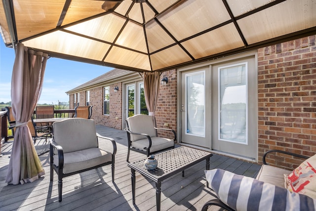 deck featuring an outdoor living space and a gazebo