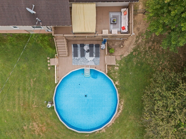 view of swimming pool featuring a pergola and a yard