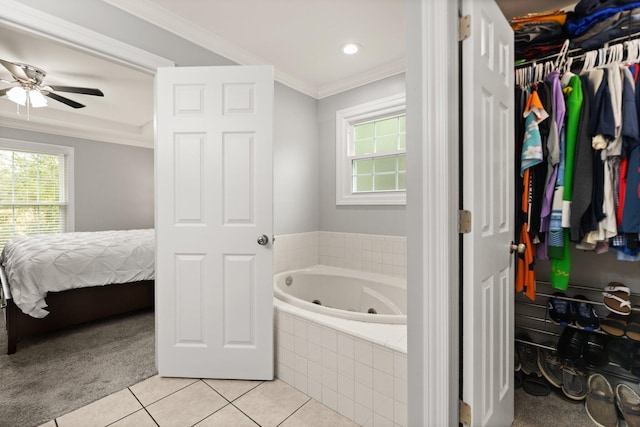 bathroom featuring crown molding, tiled bath, tile patterned floors, and ceiling fan