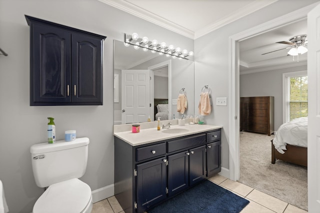 bathroom featuring tile patterned flooring, toilet, ceiling fan, ornamental molding, and vanity