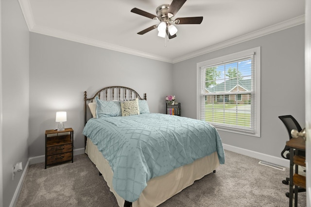 bedroom with crown molding, ceiling fan, and carpet floors