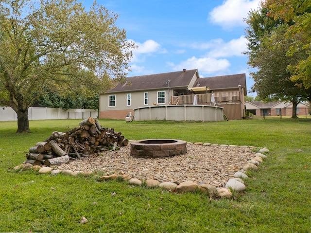 view of yard with a fire pit