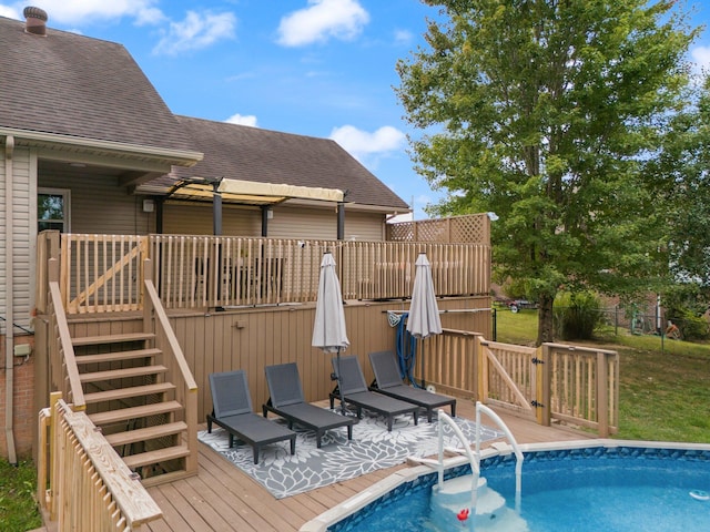 view of swimming pool featuring a deck