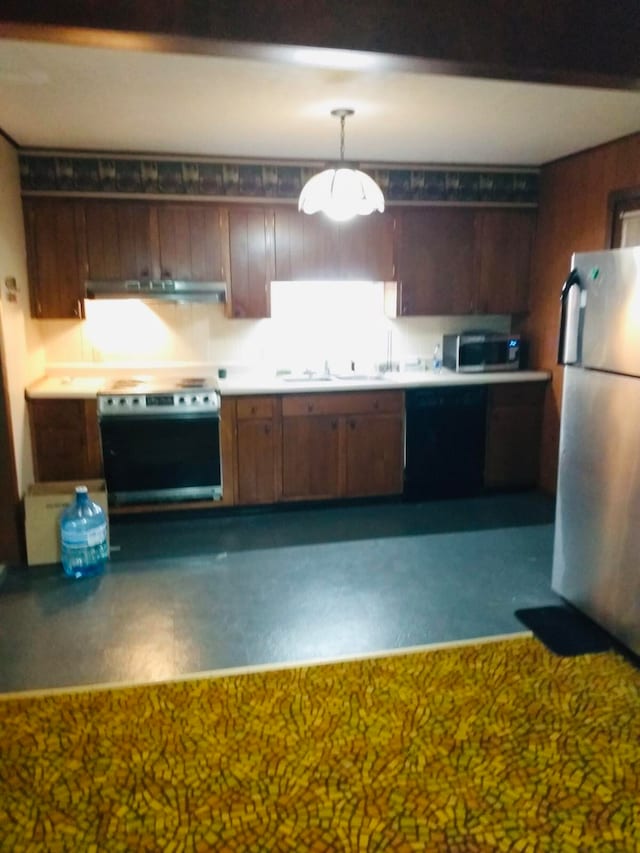 kitchen featuring sink, stainless steel appliances, extractor fan, and hanging light fixtures