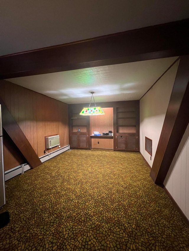 interior space featuring baseboard heating, wood walls, and a wall unit AC