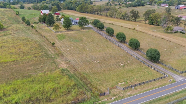 birds eye view of property with a rural view