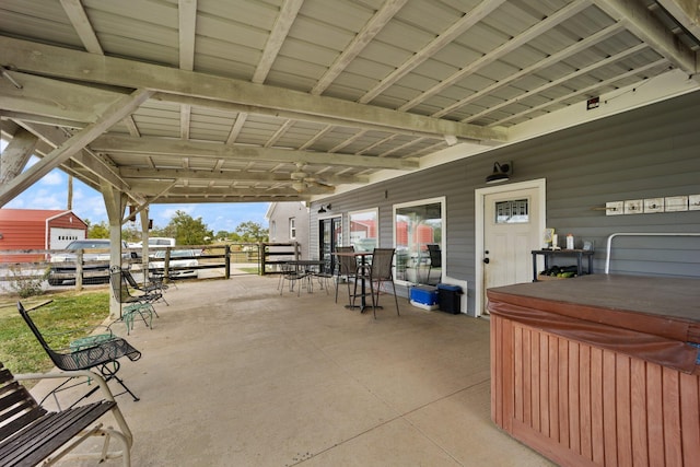 view of patio / terrace with a hot tub